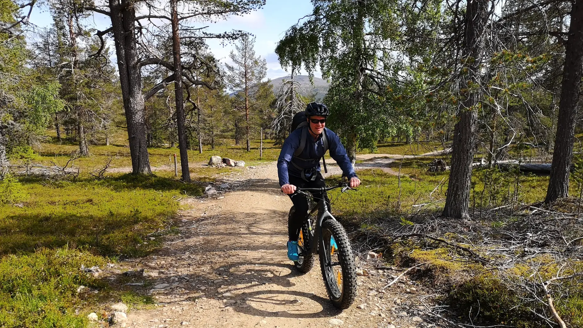 A man biking up the fell. 