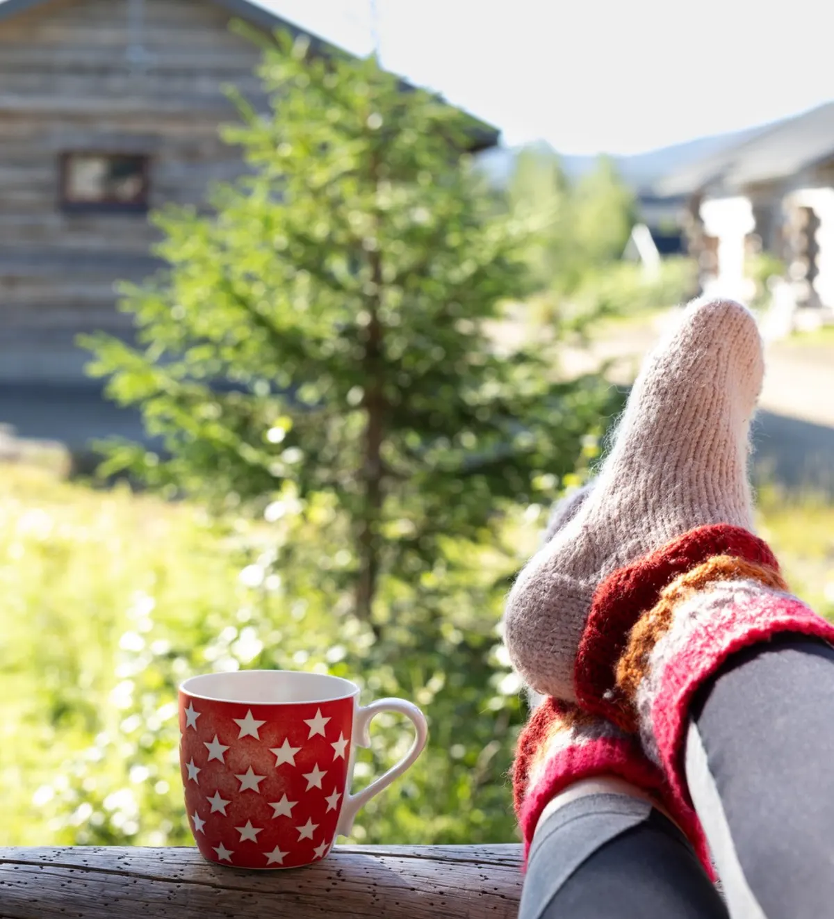 Peaceful slow morning at a cabin in Lapland with coffee on the terrace and relaxing summer atmosphere